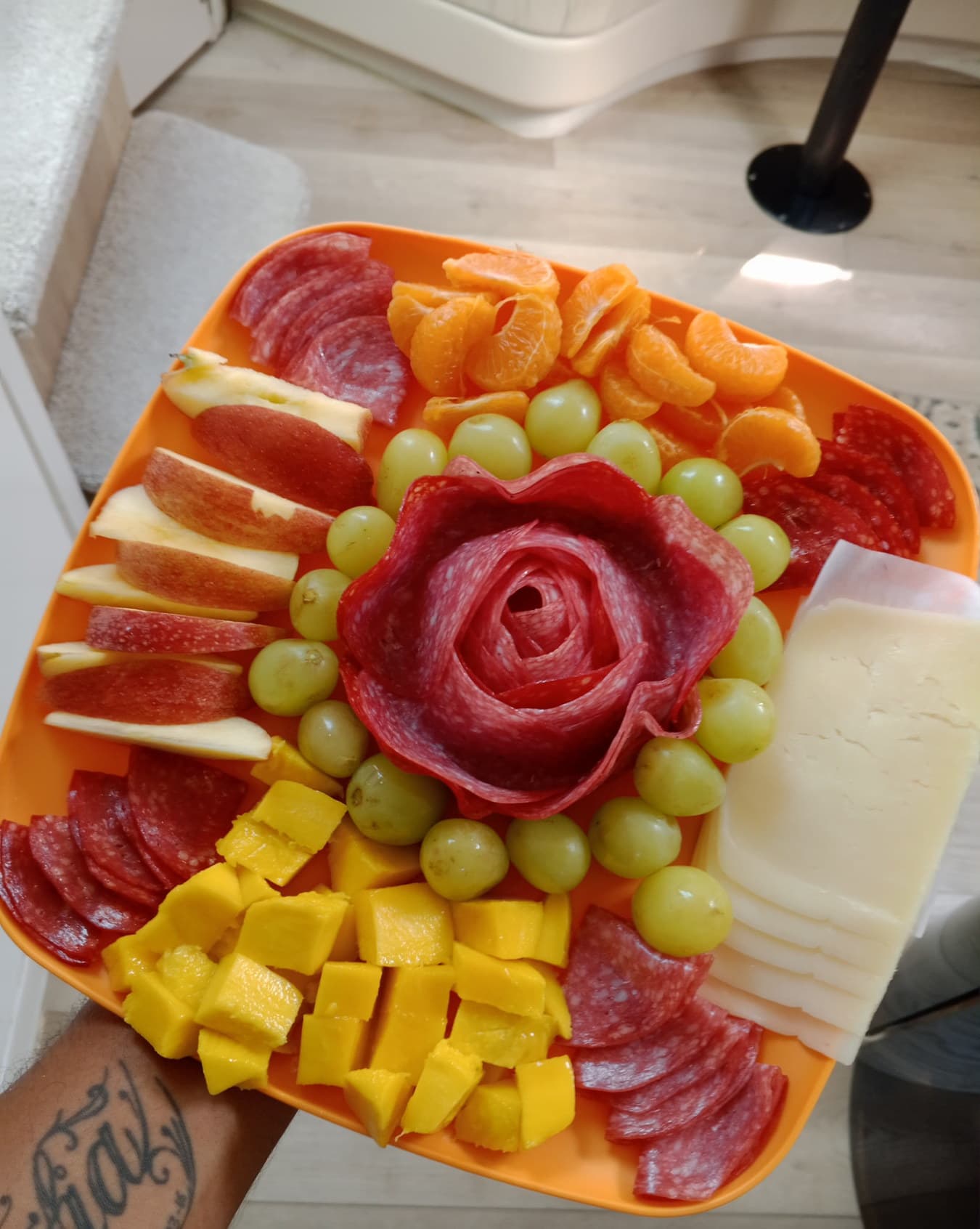 Cold cut, fruit, and cheese board available for onboard service