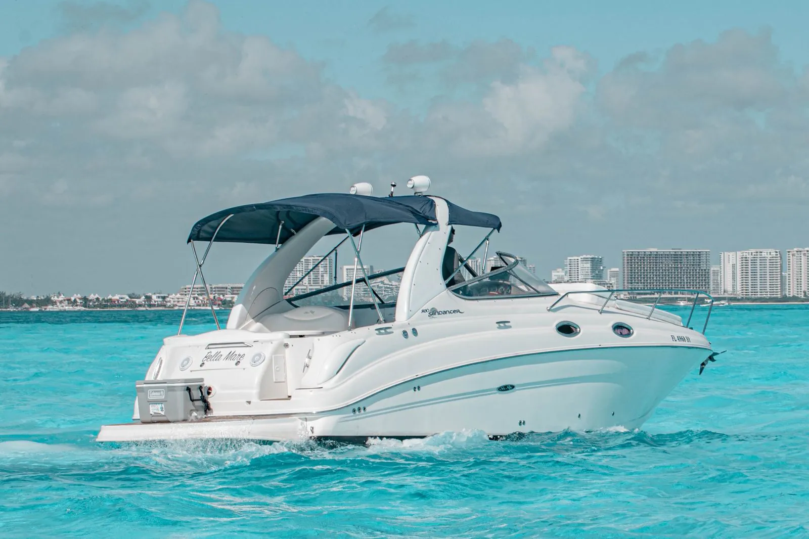 A Cancún yacht day with the coastline close and the water wide open