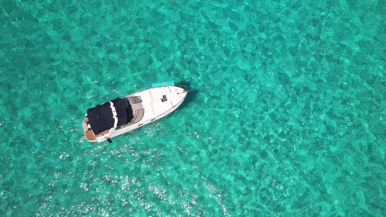 A private yacht centered in uninterrupted turquoise water
