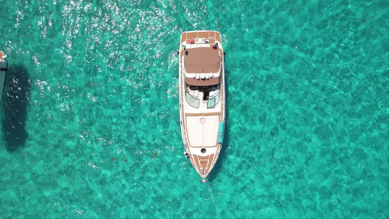 A private yacht moment anchored in crystal-clear Caribbean water