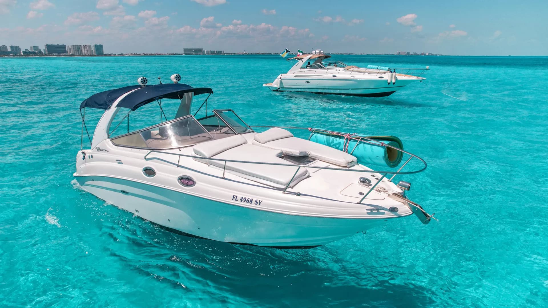 Luxury yacht sailing on turquoise Caribbean waters in Cancún